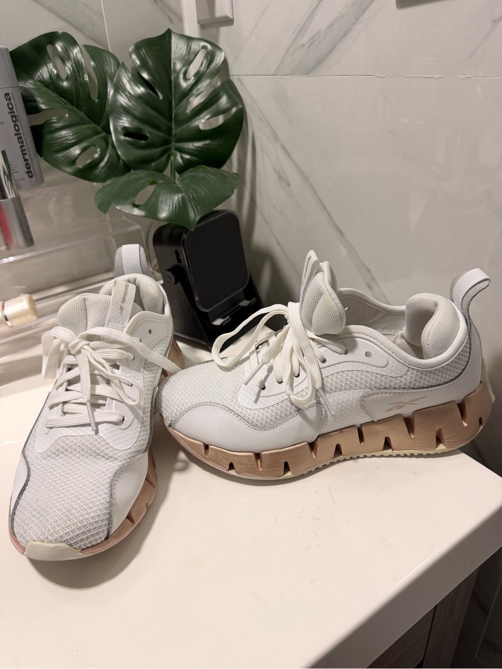 Reebok Women’s White Sneakers with Rose Gold Accent Sole